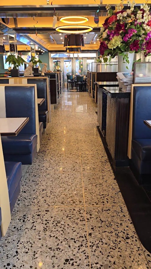 Bright diner booths and tables inside.