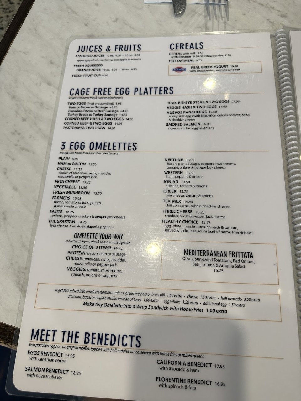 Diner menu featuring omelettes and sandwiches.