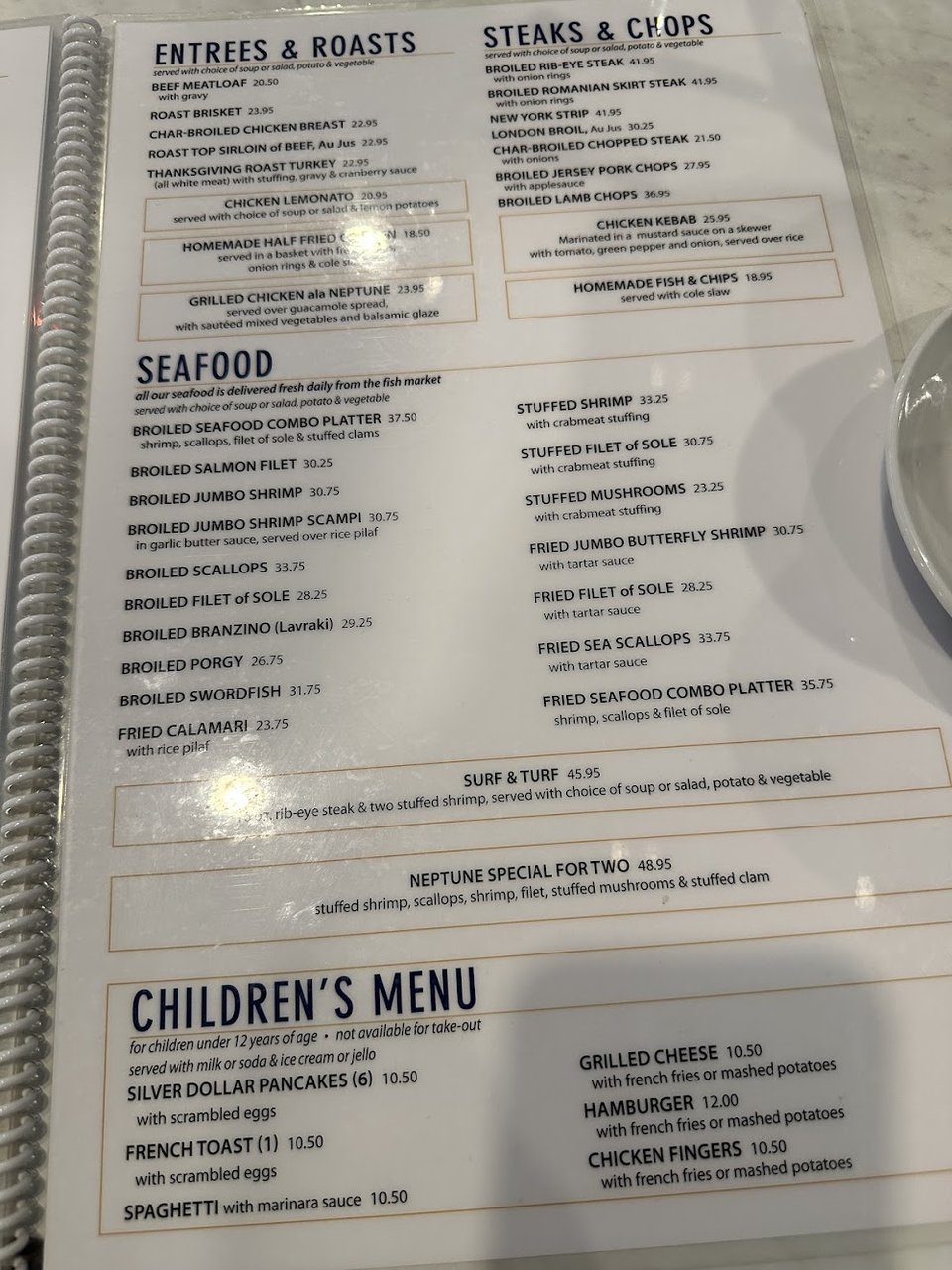 Printed menu with classic breakfast plates.